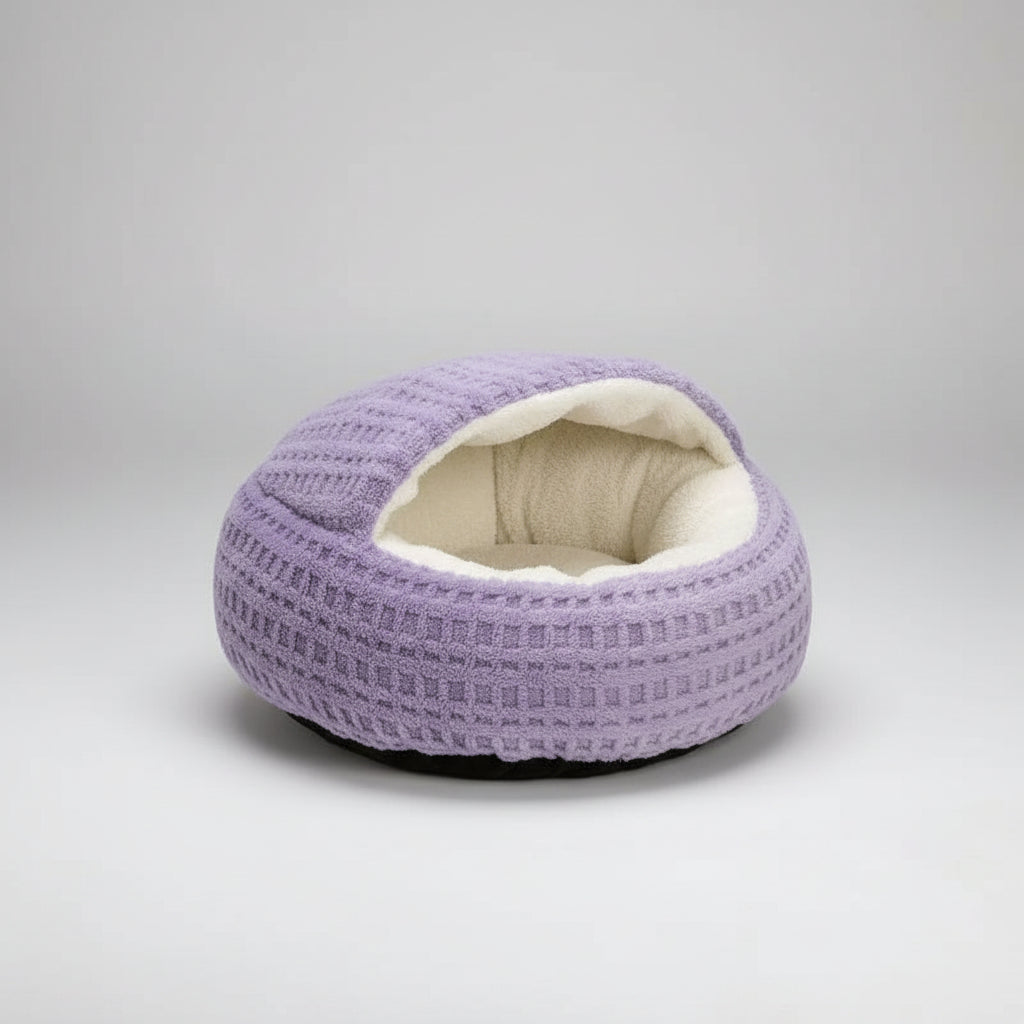 A round, waffle-textured pet bed in light purple with a soft cream-colored fleece lining, shown on a plain white background.