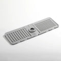 Gray rubber mat with drainage holes on a white background