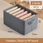 Gray storage box with built-in PP board and dimensions on a wooden floor.