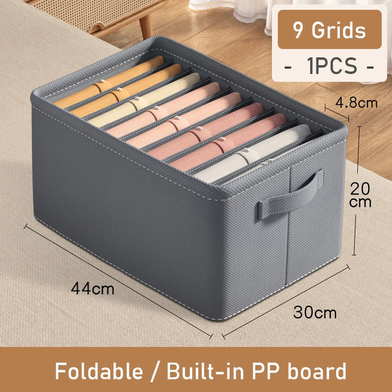 Gray storage box with colorful items inside, dimensions displayed, on a wooden floor.