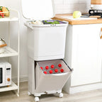 Kitchen compost bin with a visible separation of organic waste in a kitchen setting.
