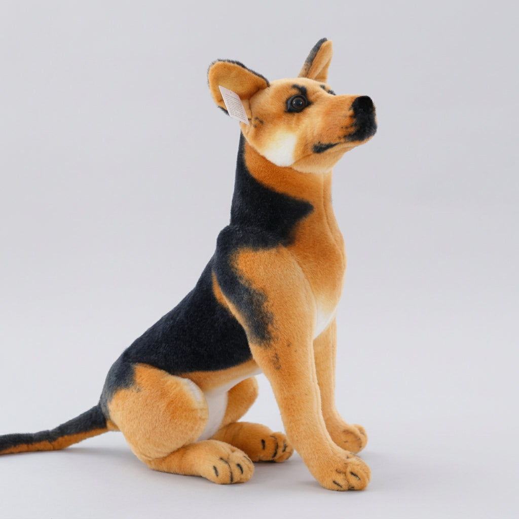 Plush toy dog sitting on a white floor with a blurred indoor background