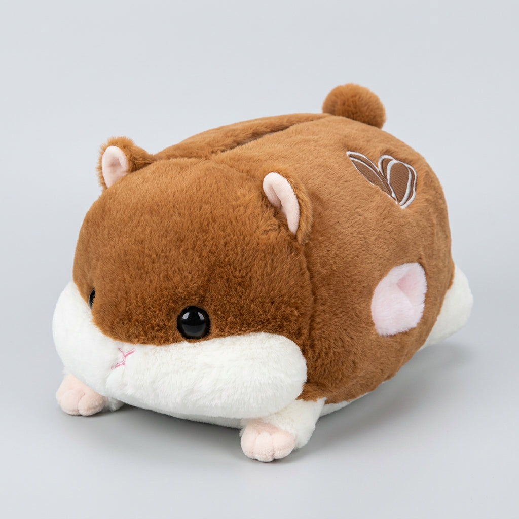 Plush toy resembling a hamster on a wooden surface with a blurred background