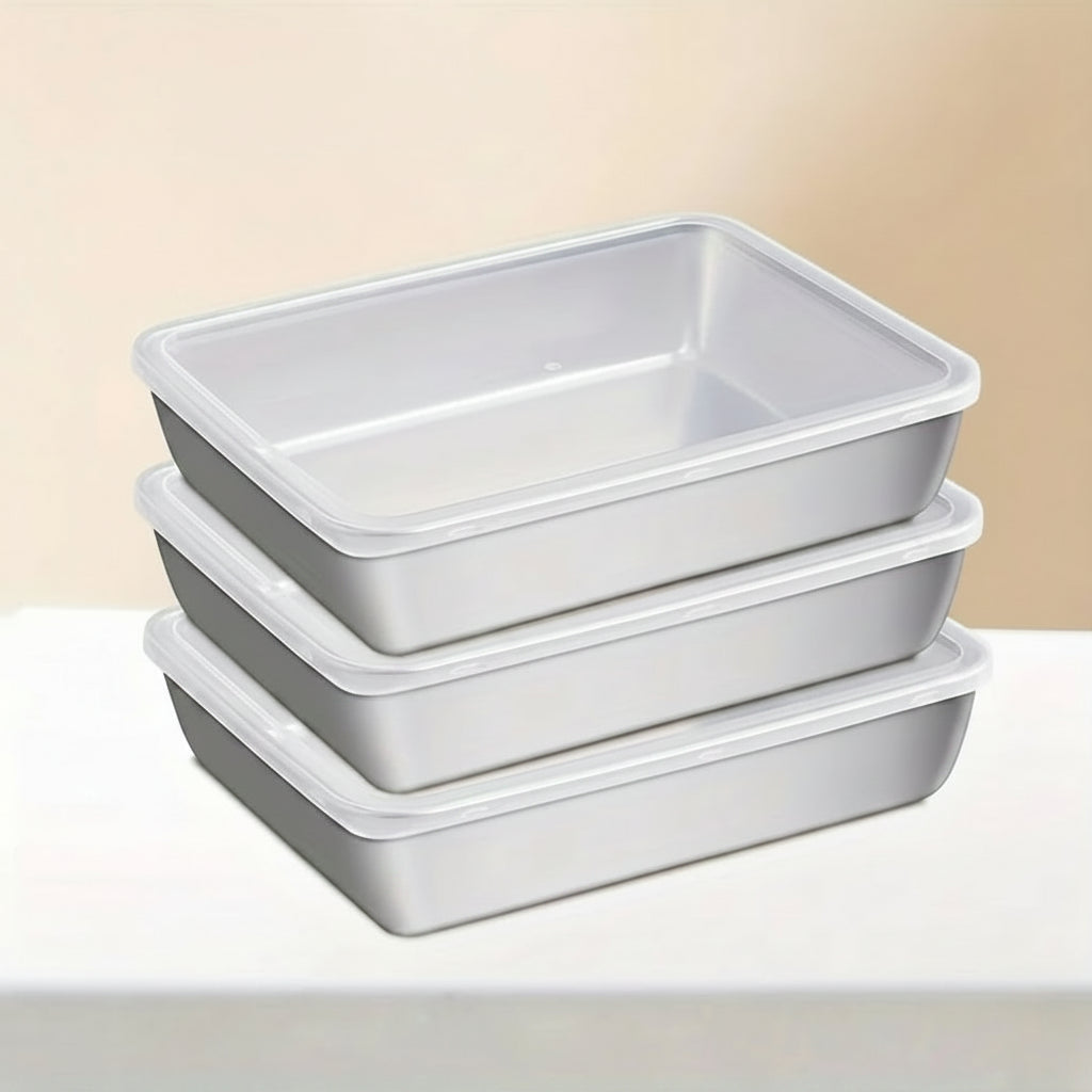 Three gray rectangular baking pans stacked on a beige background with 