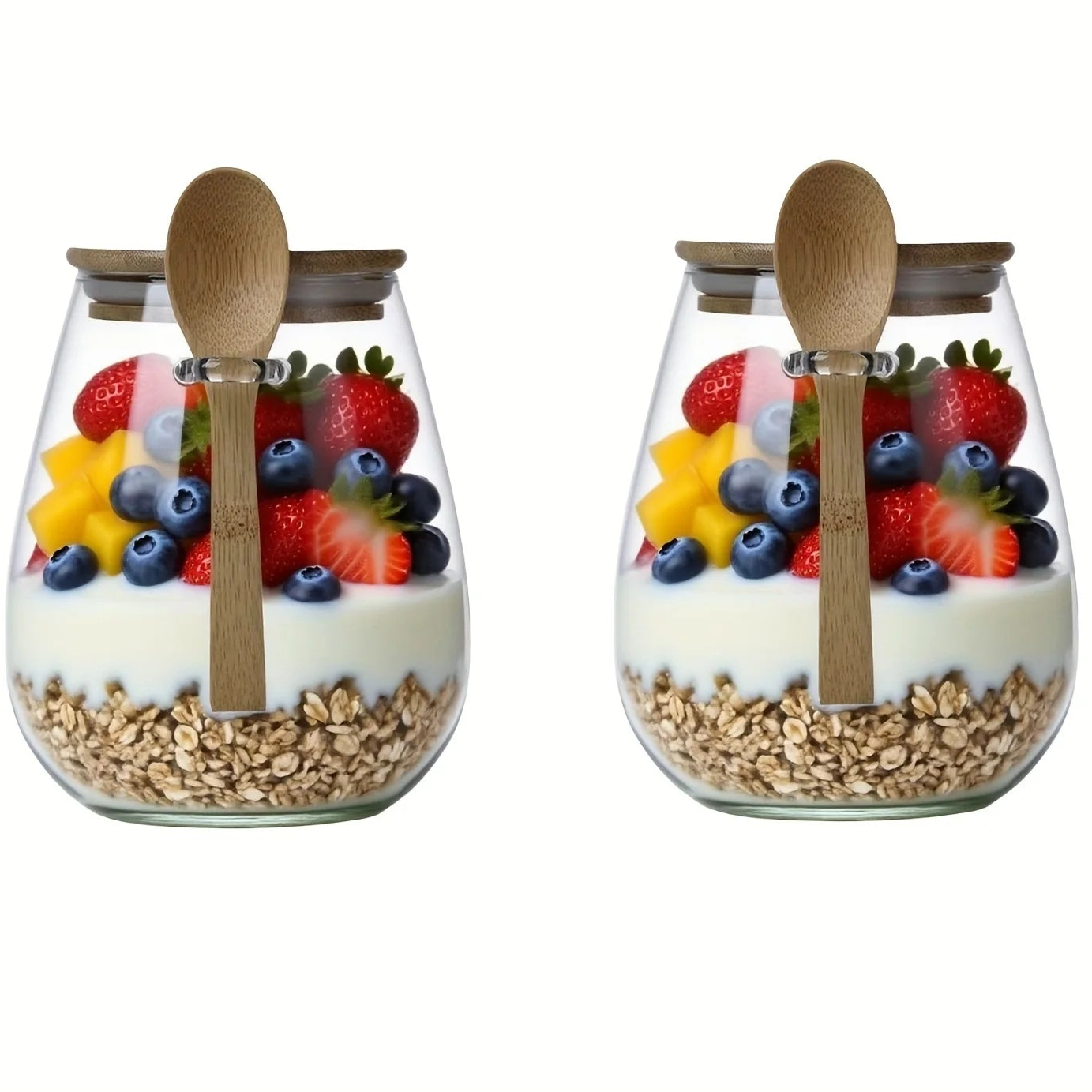 Two clear glass jars filled with yogurt, granola, strawberries, blueberries, and star-shaped fruit pieces, each with a bamboo spoon and bamboo lid, shown on a white background with a yellow '2PCS' badge in the top right.