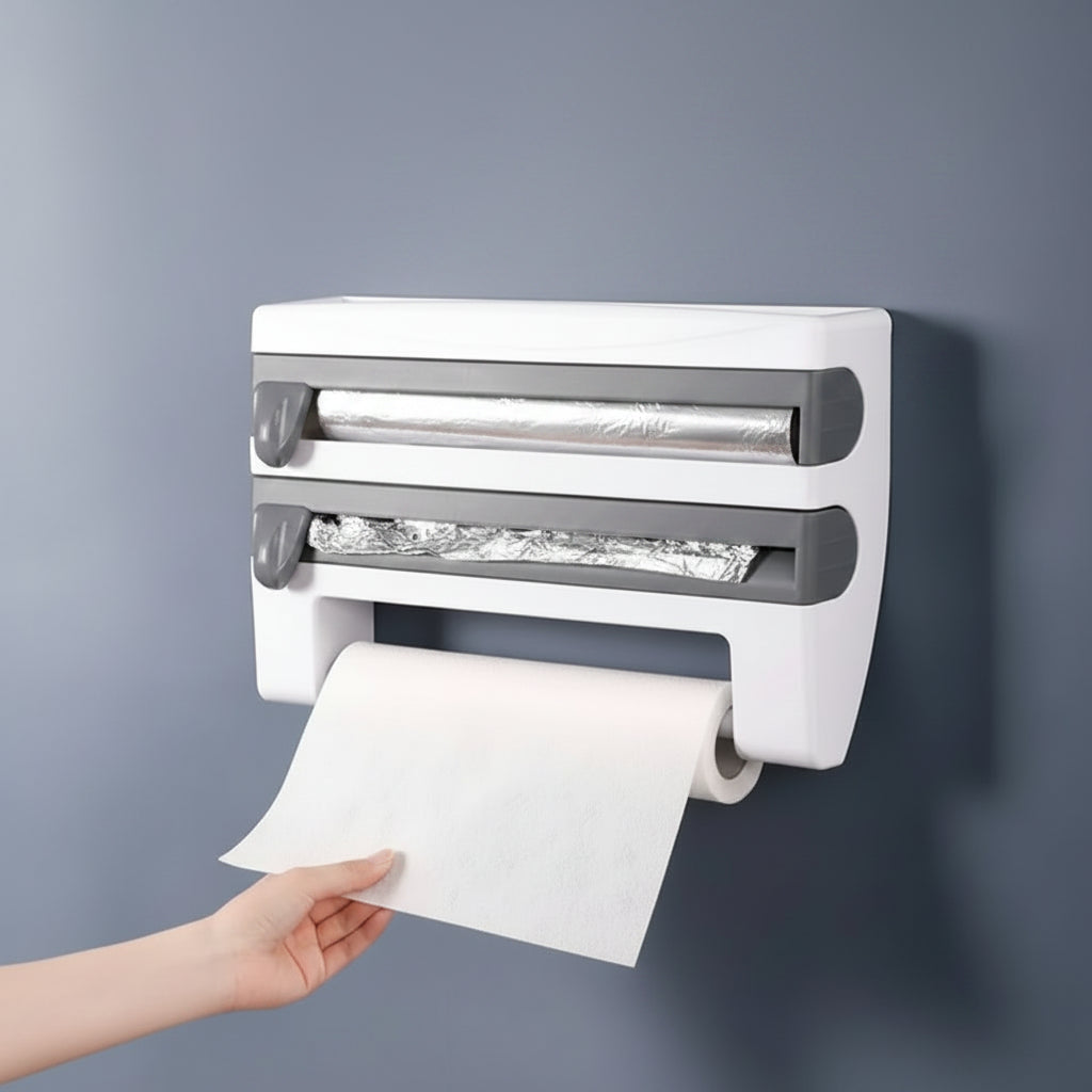 Wall-mounted paper towel holder with a hand pulling out a roll of paper towels against a gray background.