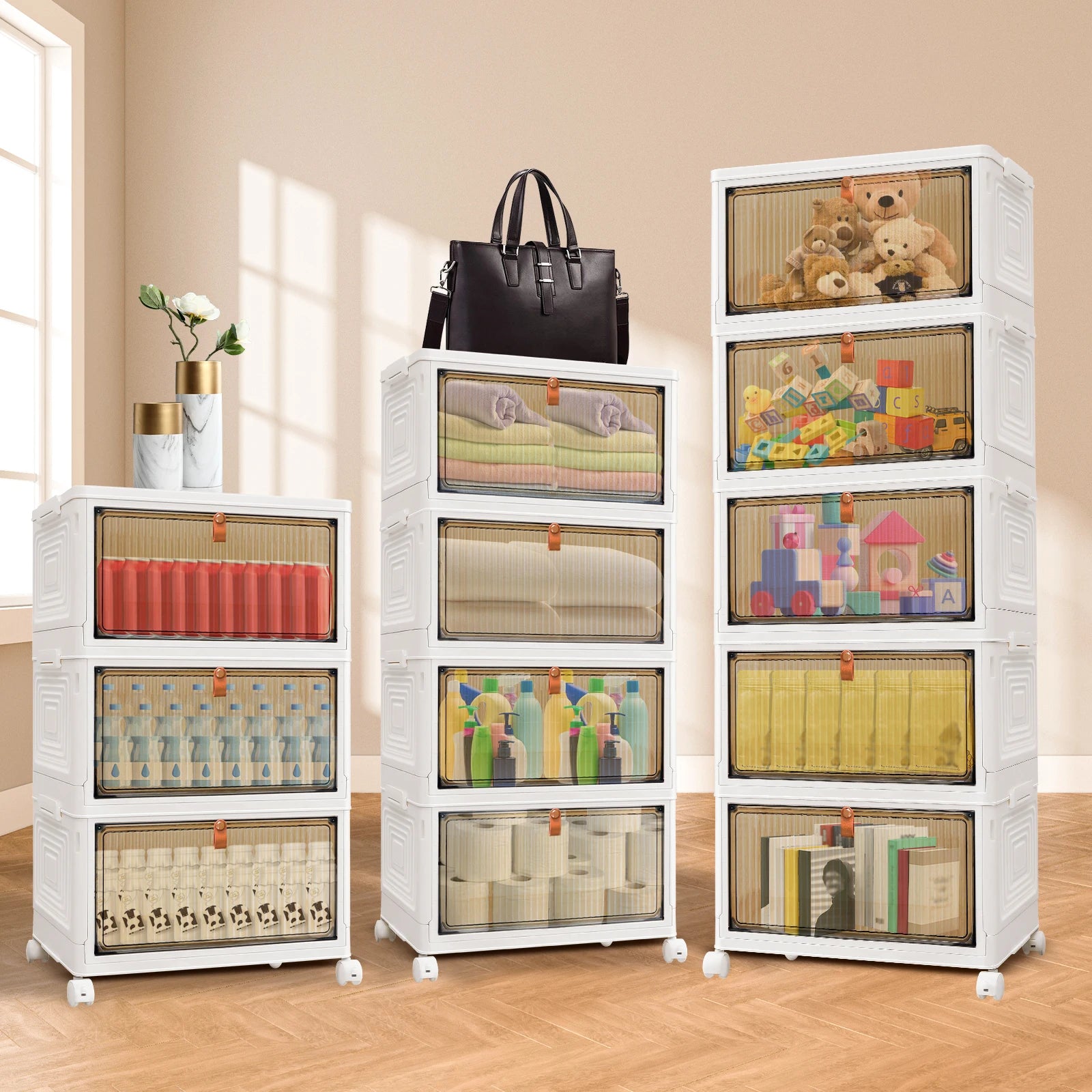 White storage cabinets with transparent drawers containing various items on a wooden floor.