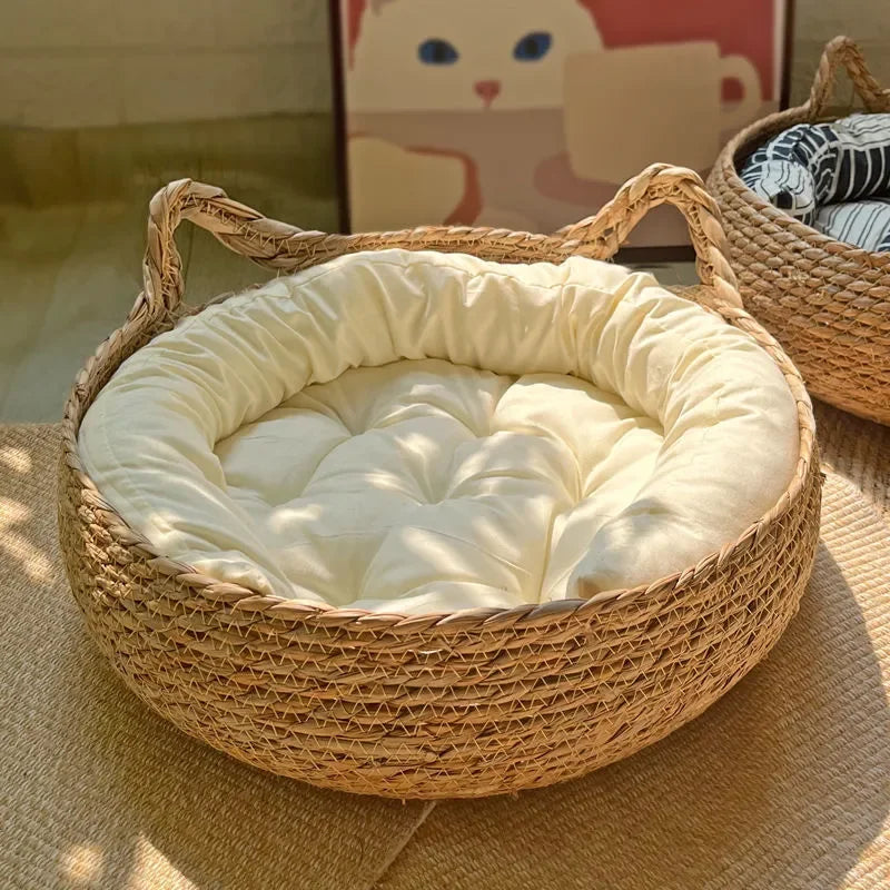 Woven pet bed with a soft cream cushion inside, placed on a textured surface.