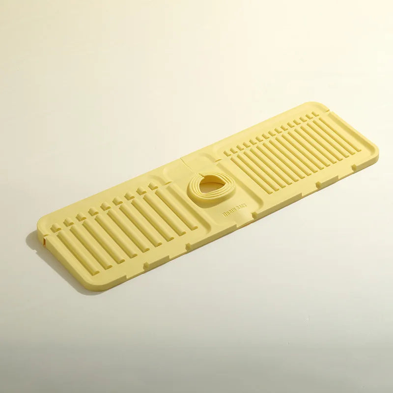 Yellow plastic mat with drainage holes on a beige background